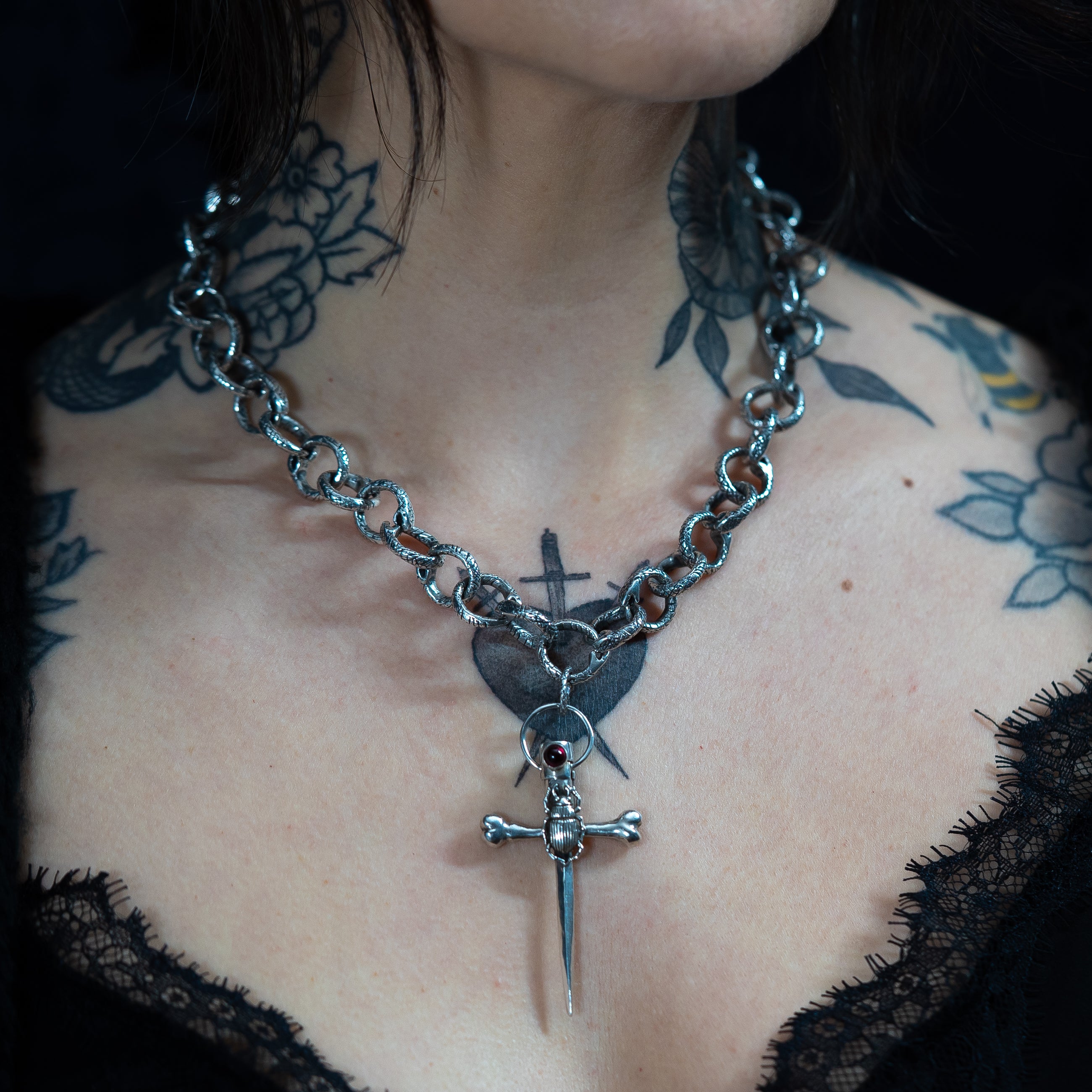 gothic handmade chunky chain necklace in sterling silver on alternative model with a dagger pendant hanging from the chain