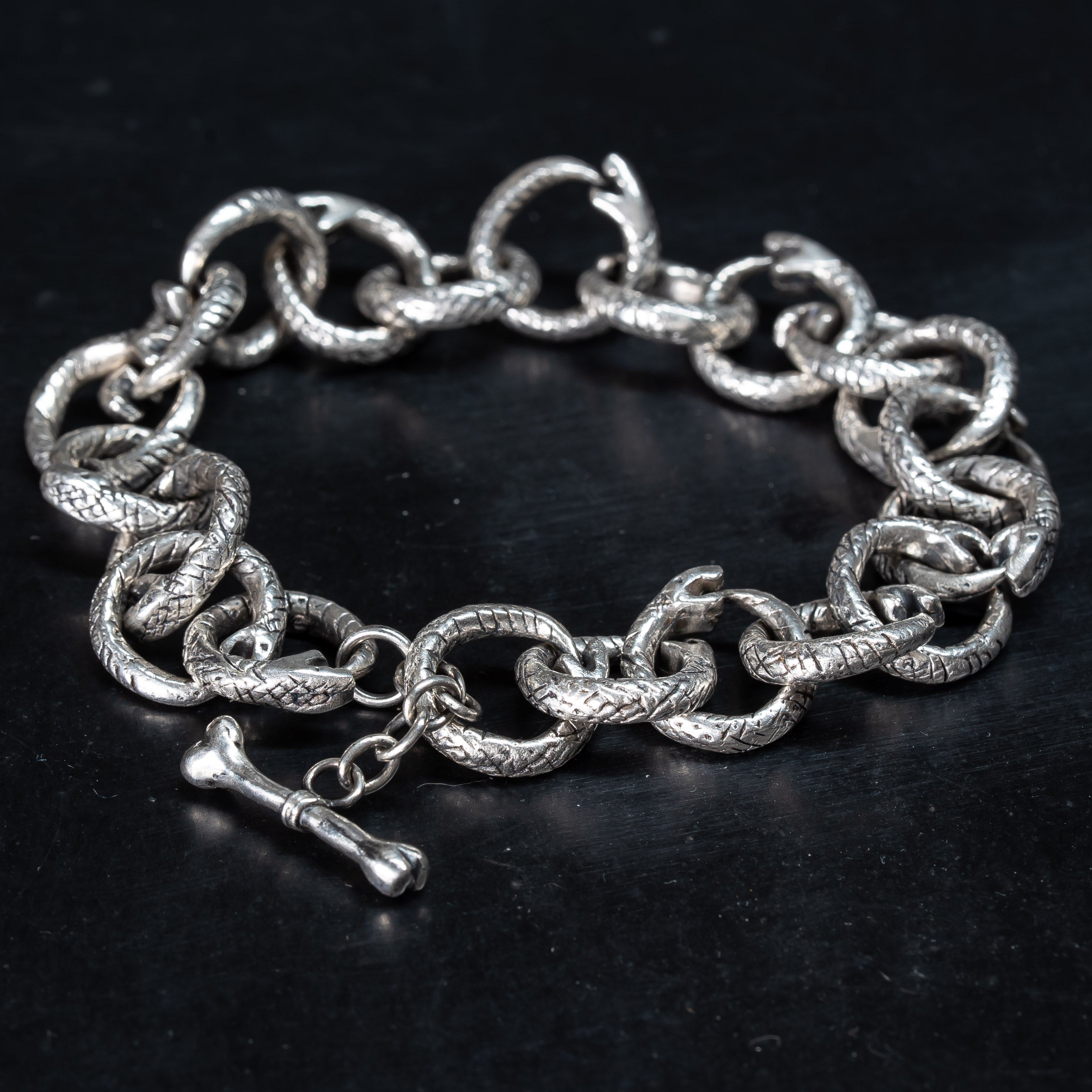  Unique silver bracelet made of individual snakes eating their own tails, otherwise known as the Ouroboros. Gothic style handmade jewellery.