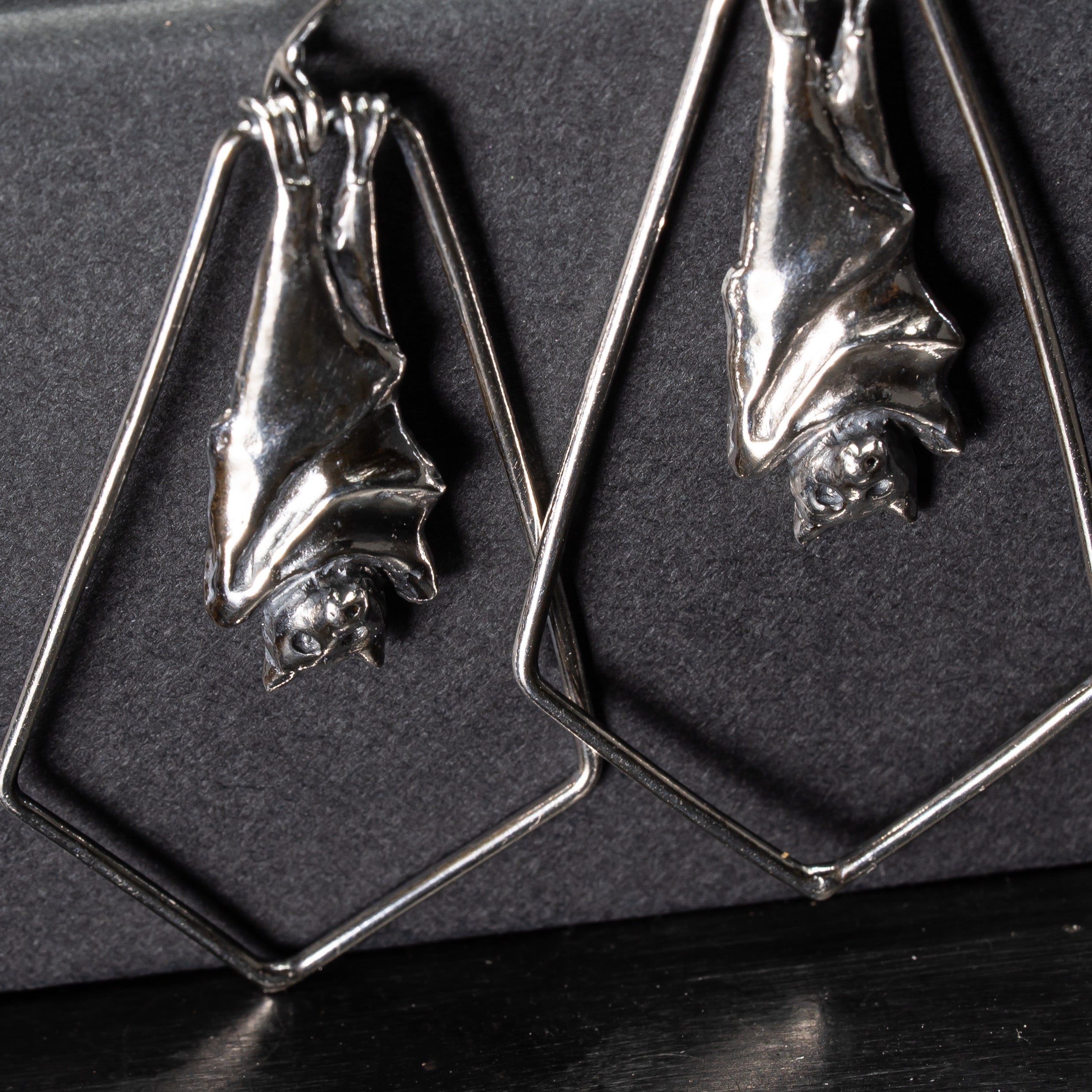 Close up detail of flying fox earrings