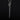 A handmade, oxidised sterling silver coffin nail charm hanging on a chain by a silver snake bail, displayed on a dark black background.