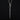 A handmade, oxidised sterling silver coffin nail charm hanging on a chain by a silver snake bail, displayed on a dark black background.