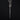 A handmade, oxidised sterling silver coffin nail charm hanging on a chain by detachable clasp displayed on a dark black background.
