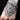 Handmade snake-link bracelet on a tattooed wrist with a black background