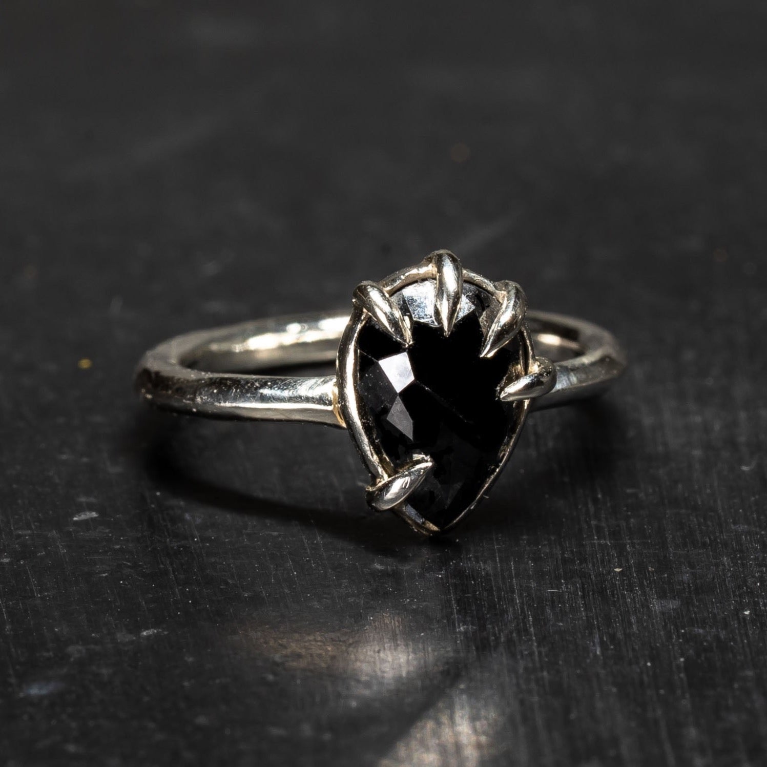 front view of pear shaped black diamond ring made by Bonearrow