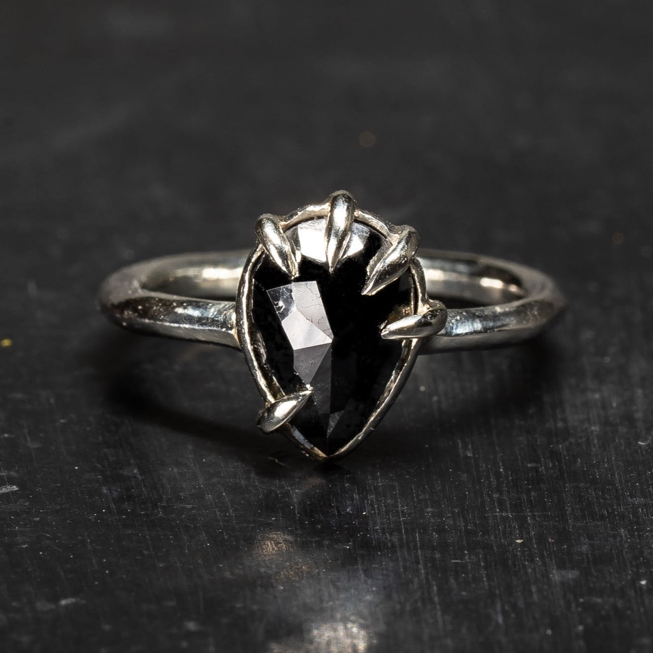 Teardrop shaped Black Diamond Ring with unique  claw style grips