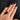 Hand model wearing  black onyx coffin ring