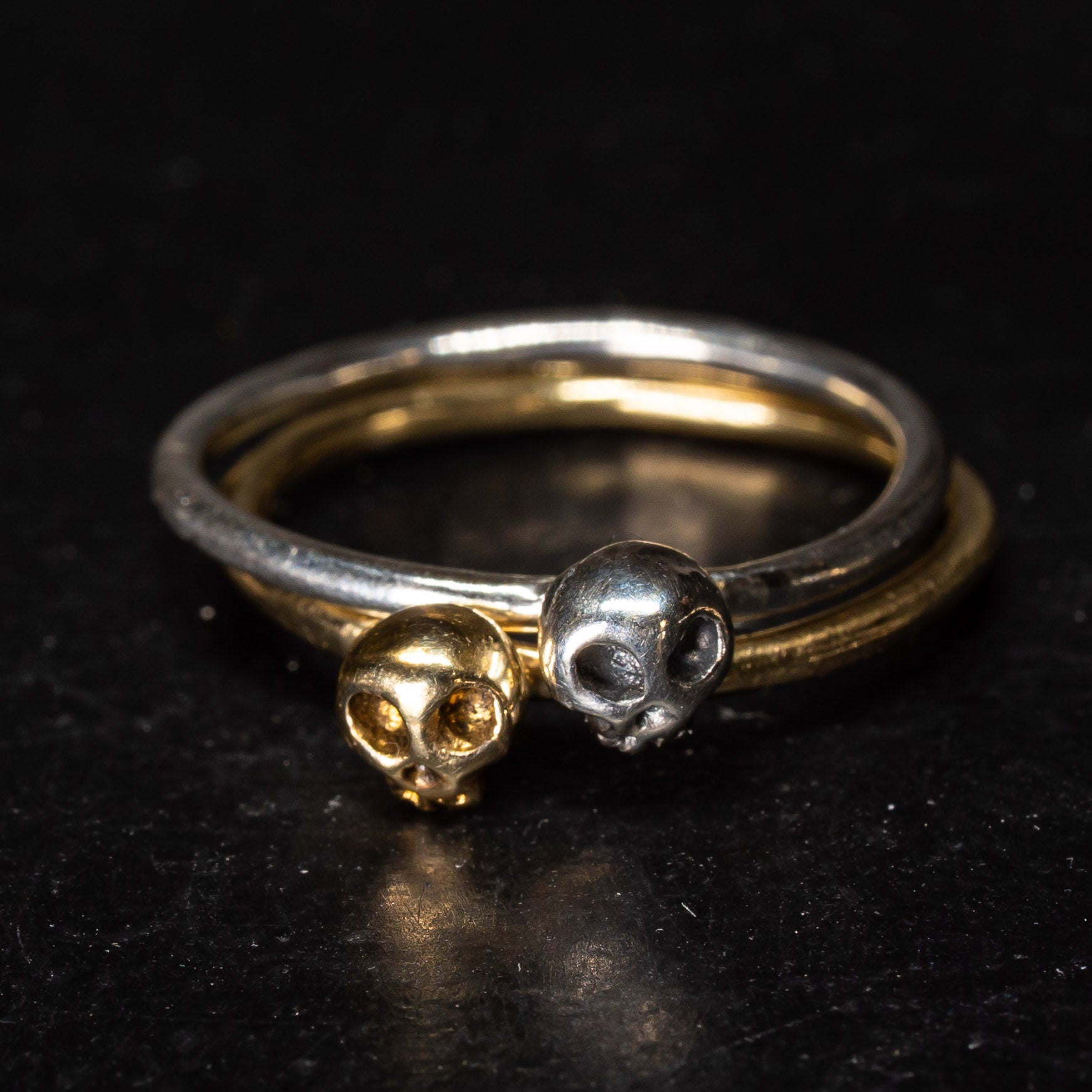 Gold and silver skull staking rings